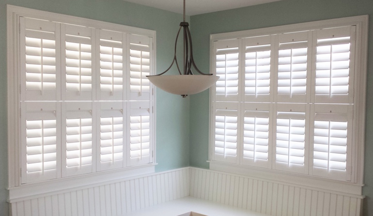 Soft green wall in Chicago kitchen with shutters.